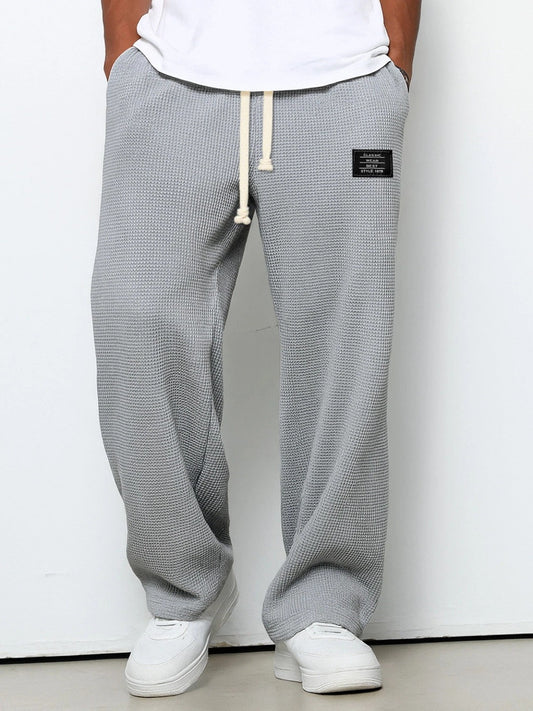 Men's Waffle-Textured Drawstring Trousers with Side Pockets and Wide Legs for Casual Wear