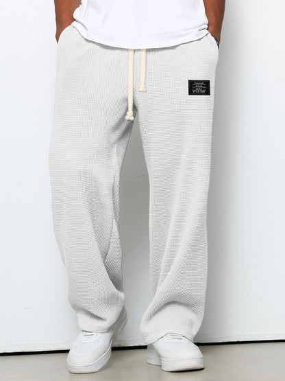 Men's Waffle-Textured Drawstring Trousers with Side Pockets and Wide Legs for Casual Wear - Image 3