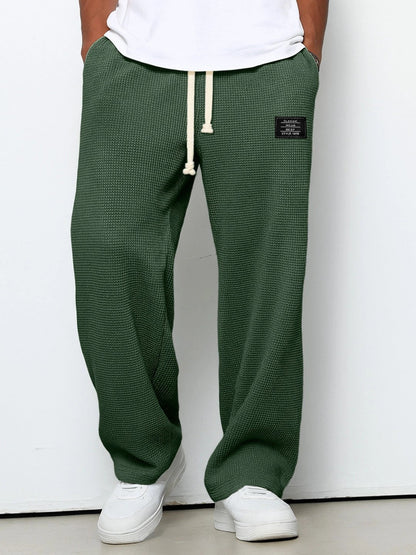 Men's Waffle-Textured Drawstring Trousers with Side Pockets and Wide Legs for Casual Wear - Image 9